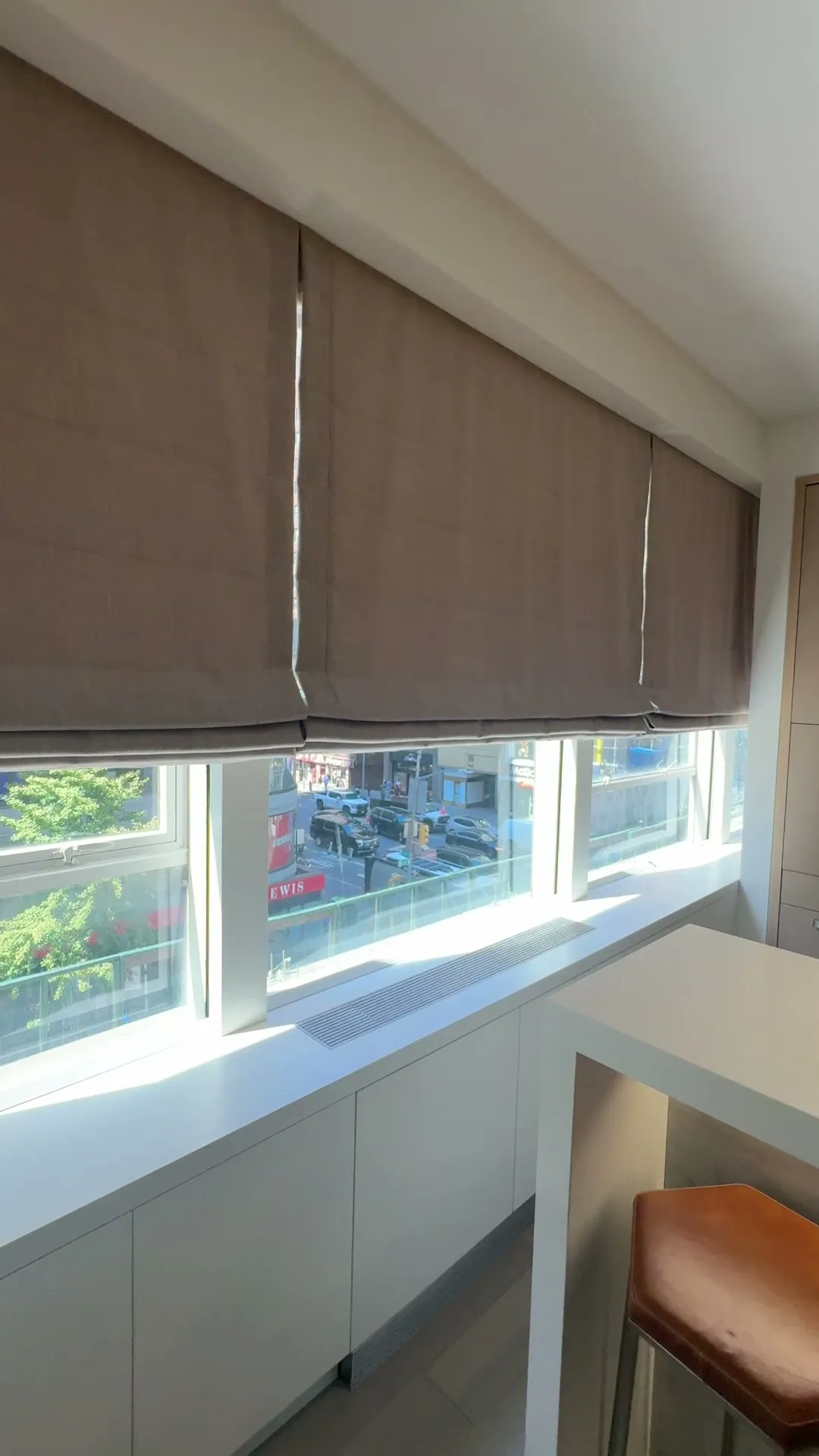 Roman shades across a New York kitchen window
