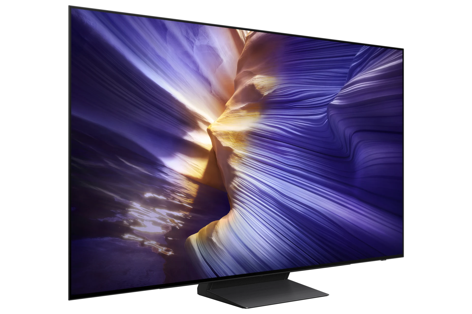 Samsung OLED S90F viewed from a three-quarter angle, showing the slim panel and center pedestal stand