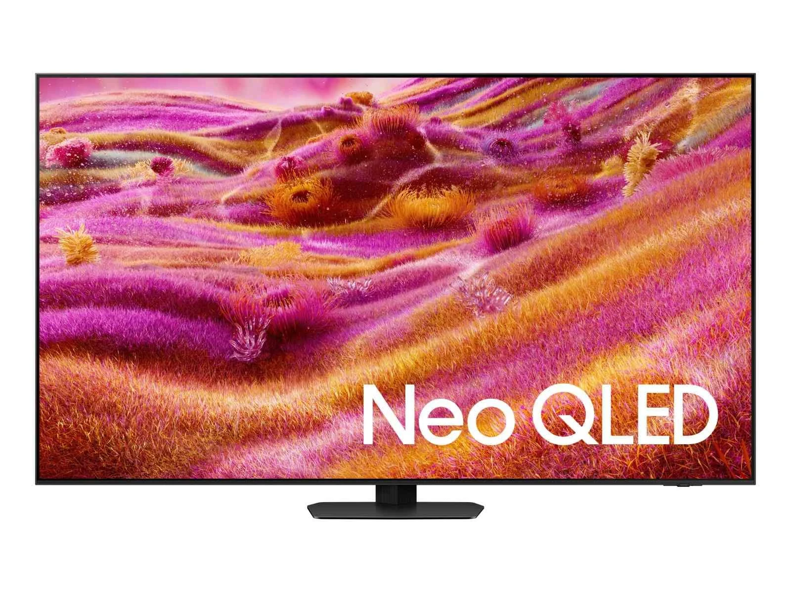 The Neo QLED 4K QN90F shown straight on with a magenta and gold grass-like abstract wallpaper and 'Neo QLED' text on screen, on its center pedestal stand.