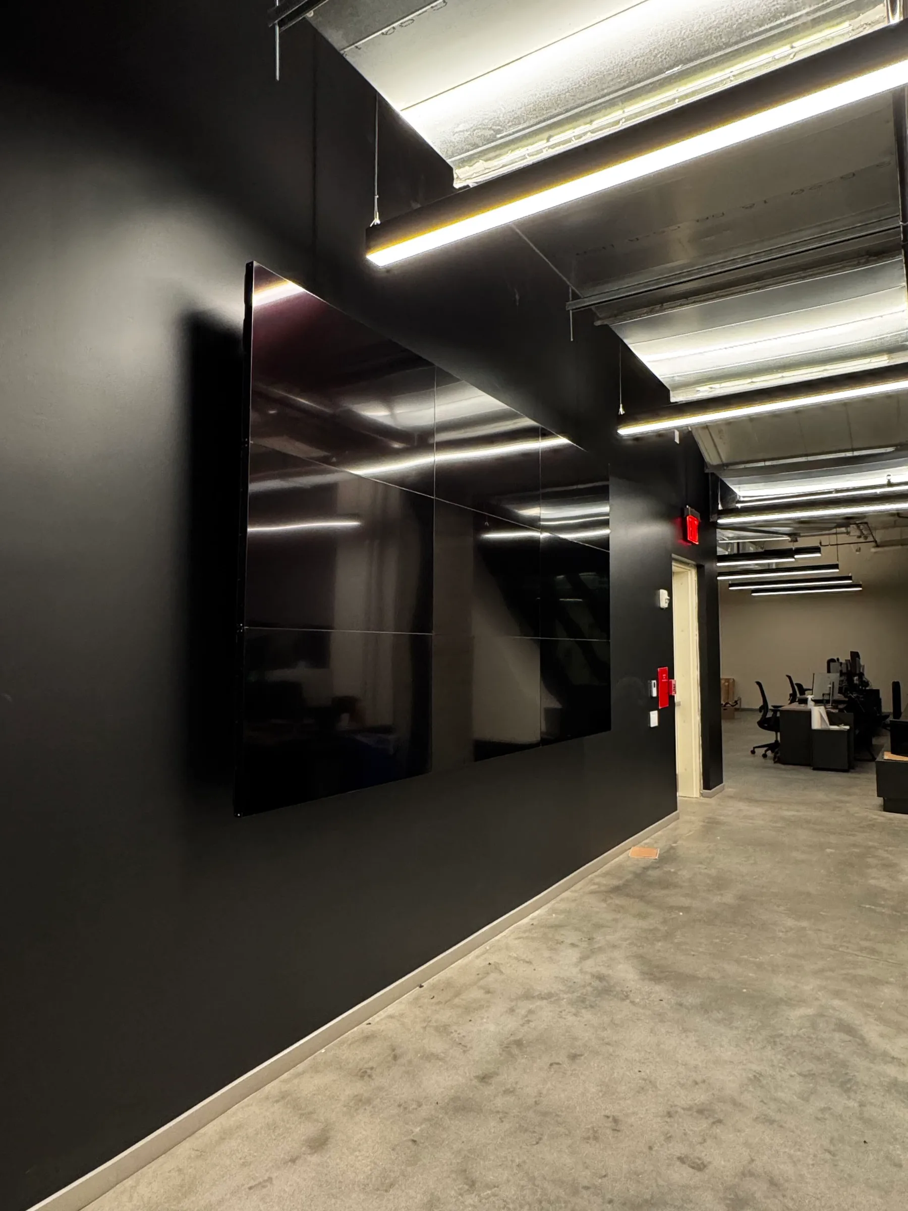 Nine Video Wall screens showing separate content in a Brooklyn office