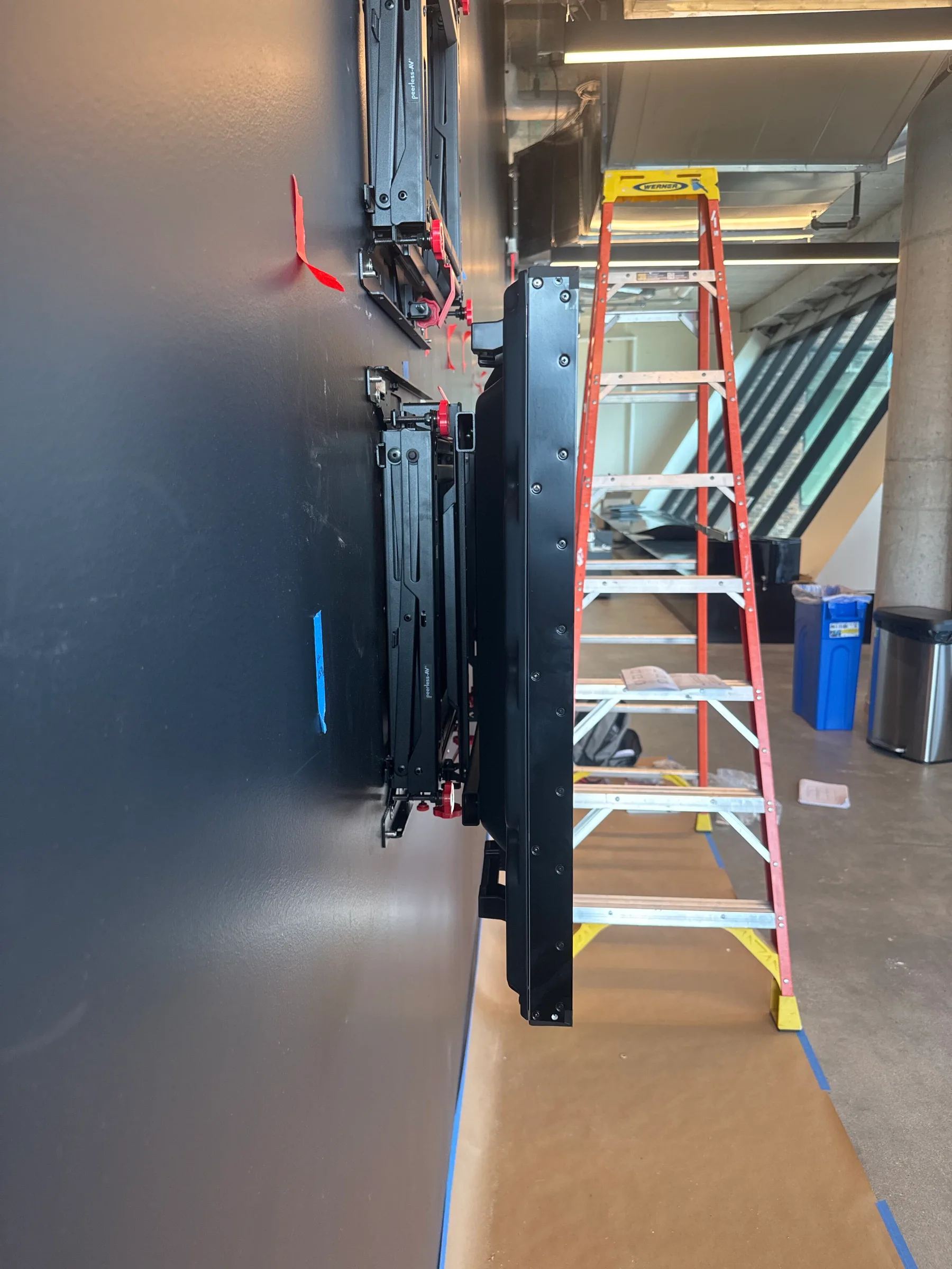 3×3 Video Wall grid measured on a black office feature wall