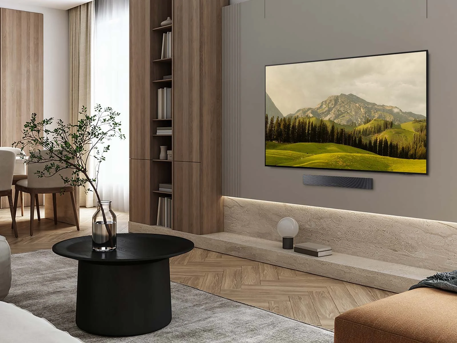 Samsung OLED S85F wall-mounted above a soundbar in a wood-paneled living room with a mountain landscape on screen