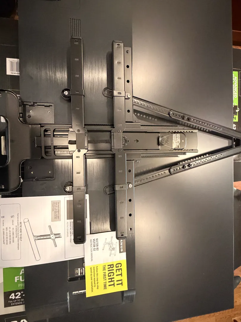 The Sanus VLF728 full-motion mount and its instructions, on top of its box, before being installed.