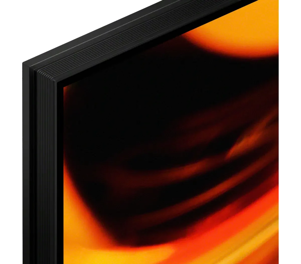 Extreme close-up of the top corner of the BRAVIA 7 II screen and bezel, showing the thin dark frame against orange screen content.