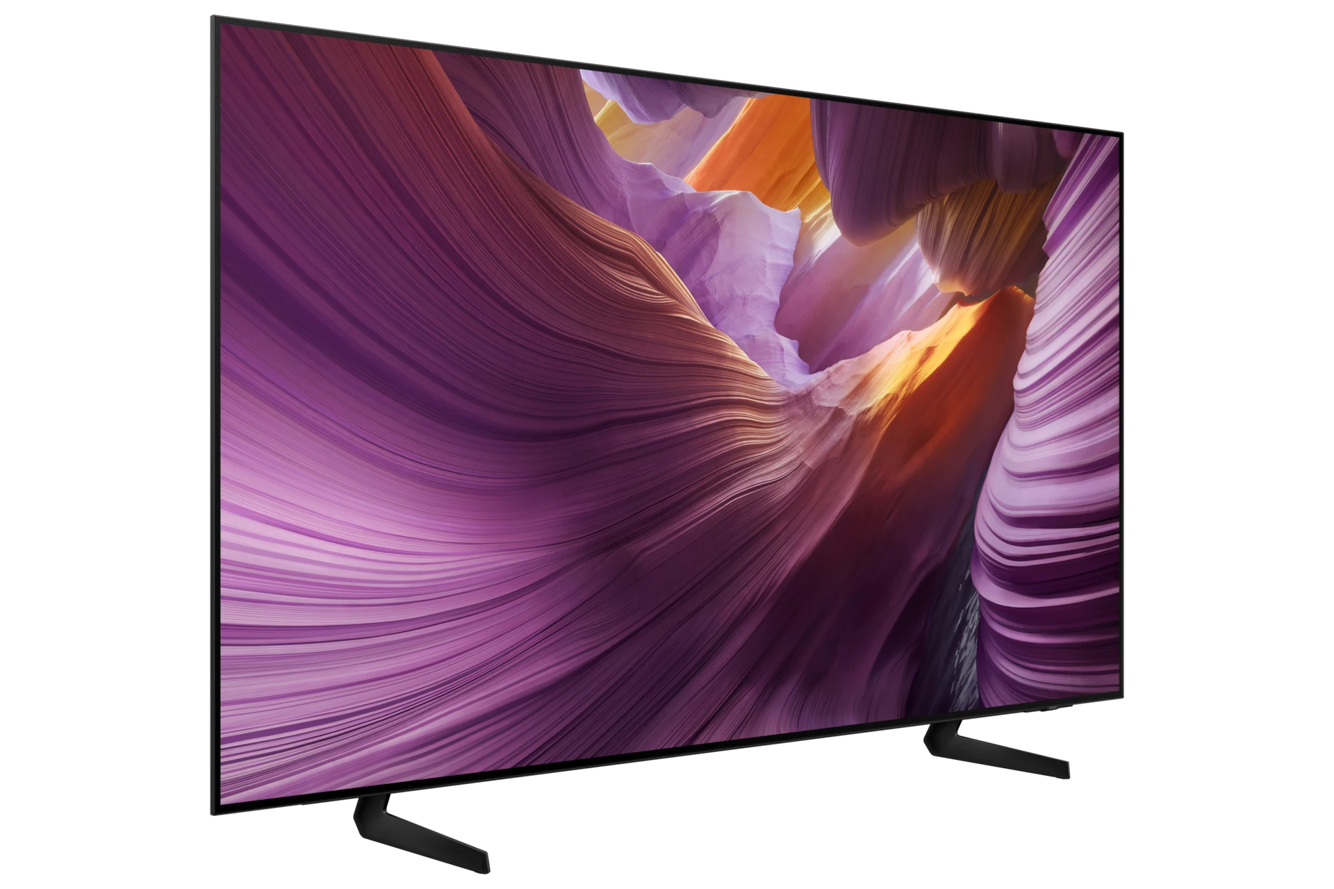 Samsung OLED S85F viewed from an angle, showing its slim panel and the two splayed stand legs